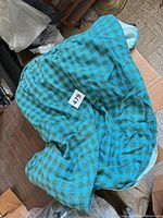 Tablecloth spread on surface showing overall size and tag 479