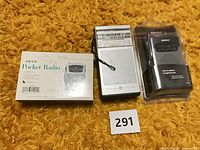 All three radios: boxed RadioShack, loose GE, sealed RadioShack