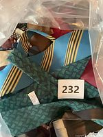 Bag containing assorted vintage ties with lot tag 232 visible
