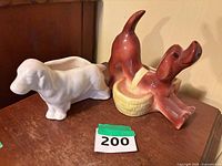 Both ceramic dog dresser caddies side by side