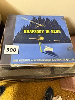 Stack of 78 rpm record albums, top album Gershwin Rhapsody in Blue Columbia set X-196