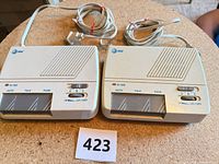 Two identical AT&T intercom units showing overall condition and attached cords