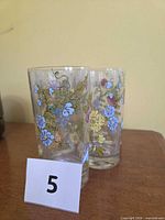 Two Corelle Spring Meadow tumblers showing floral design