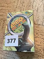 Front of original Mouse Systems Joystick in a Box packaging with joystick image
