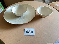 Overall view of platter, dip bowl nested, and separate footed candy dish