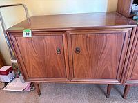 Front view of cabinet showing overall design and doors