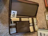 Open travel case showing all accessories secured inside