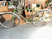Full left side view of green Schwinn boys' bicycle