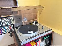Front angled view of Technics SL-1500MK2 turntable with dust cover open