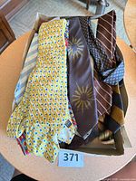 Top view of box showing multiple patterned ties