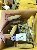 Overview of box containing assorted vintage hand tools