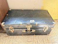 Closed trunk showing black exterior and hardware