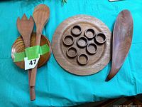 Overview: round charger, napkin rings, salad fork & spoon, small plate, leaf-shaped bowl