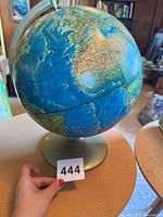 Full view of globe on stand