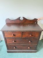 Front view showing dresser with backboard and drawer arrangement