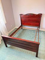 Full view of bed frame assembled showing headboard, side rails, spring grid