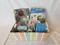 Overall lot in basket showing beads, organizers, pouch, containers