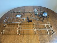 All seven racks and easels laid out on table