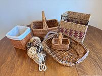 Group shot of all baskets and net bag of balls on table