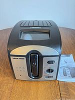 Front view of deep fryer on table