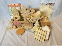 Wide view showing entire assortment of unfinished wooden craft pieces