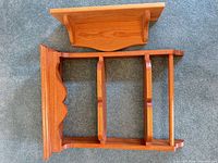 Large and small wood wall shelves laid flat showing fronts and shelf count