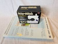 Easy-Stitch sewing machine box atop Simply Built organizer box