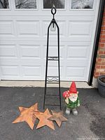 Full lot showing obelisk, three stars, gnome