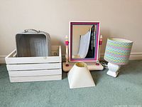 overview showing crate, basket, mirror, lamp with chevron shade, separate pyramid shade