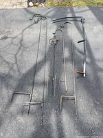 overview of all stakes and scythe on driveway
