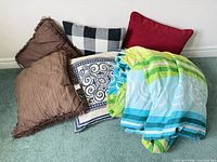 Group shot of all pillows and blanket