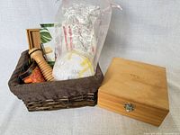 Wicker basket loaded with items alongside closed doTERRA box
