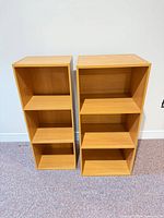 Front view of both bookcases showing shelves and finish