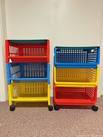 Front view of both three-tier carts showing colors and casters