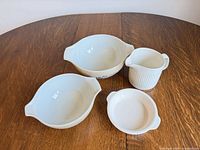 Top view of all four pieces showing shapes and handles