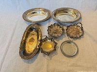 Group shot of all seven silver-plated pieces