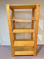 Front view showing five shelves and pine construction