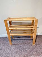 Front view of assembled solid wood 3-tier shelf