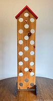 Full view of wooden display rack standing on table