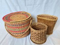 Front view of all three baskets showing shapes, colors, and lid