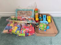 Group view of all items including blocks, puzzle, vehicles, stacker and turtle