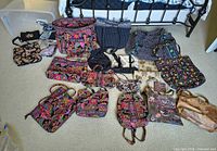 Top-down view of all bags and pouches laid out on carpet