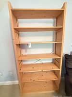 Front view of pine bookcase showing shelves and natural finish