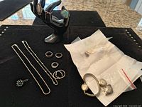 Overview of necklaces, rings, pendant, cuff bracelet and bagged items