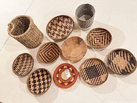 Overview of 11 woven baskets showing shapes, sizes and patterns
