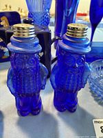 Close-up of Planters Peanut cobalt glass salt and pepper shakers