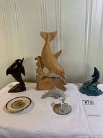 Group shot showing all six dolphin items on table