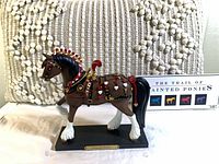 Full view of King of Hearts figurine and info card