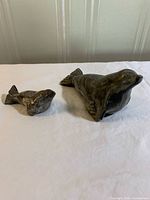Both soapstone seal figures side by side
