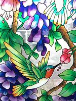 Detail of multicolour stained glass showing hummingbird and flowers